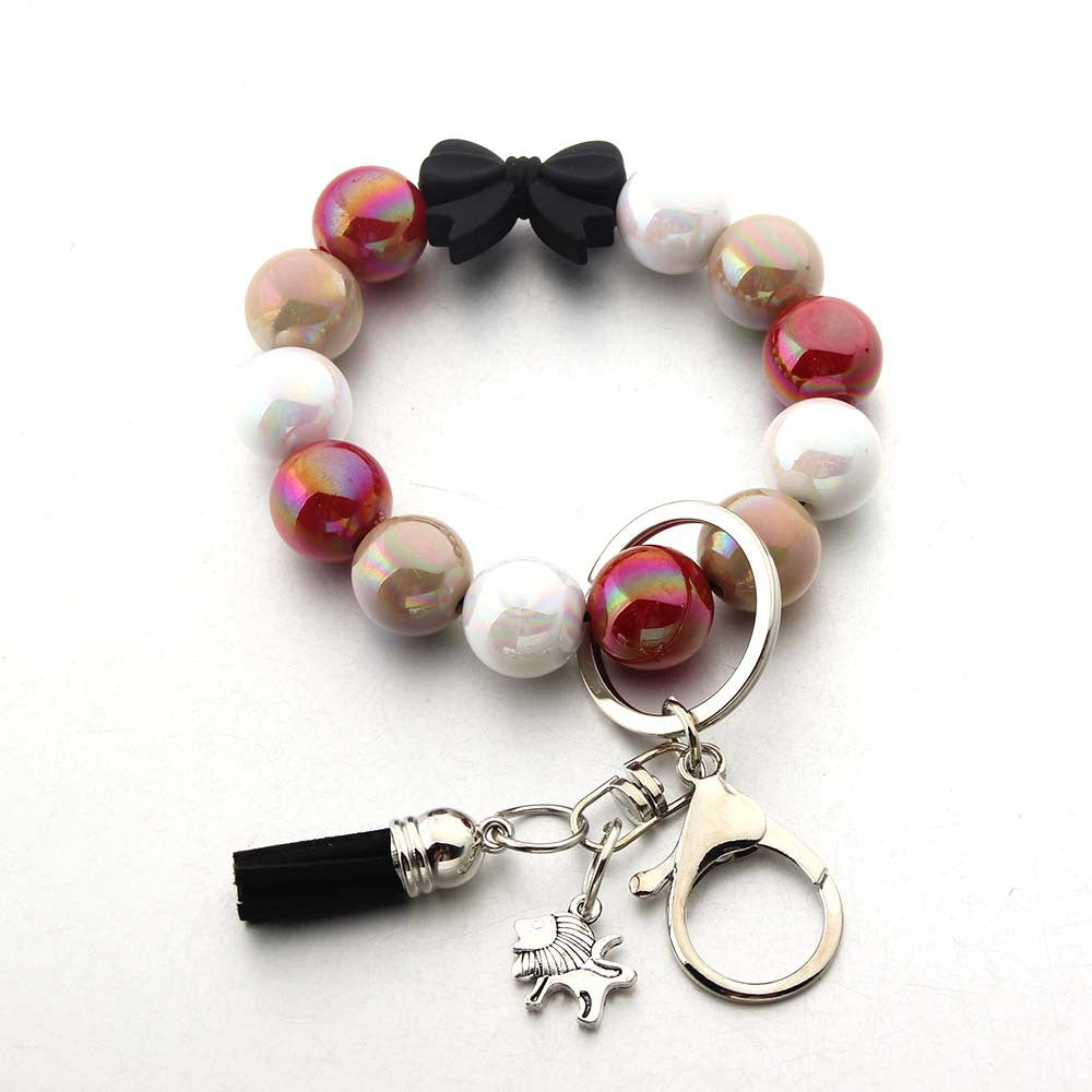 Wholesale Tassel Dragonfly Bull Head Lion Love Angel Acrylic Wrist Keychain